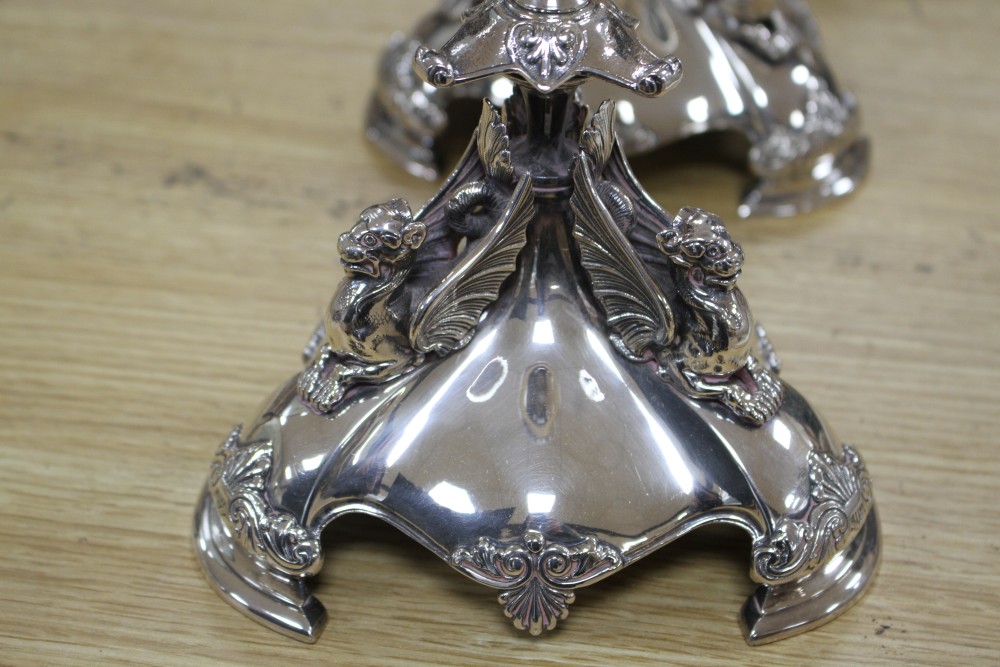 A Victorian electroplated three-piece table garniture by Elkington & Co. (lacking glass bowls),